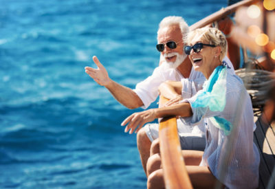 male and female seniors on a boat